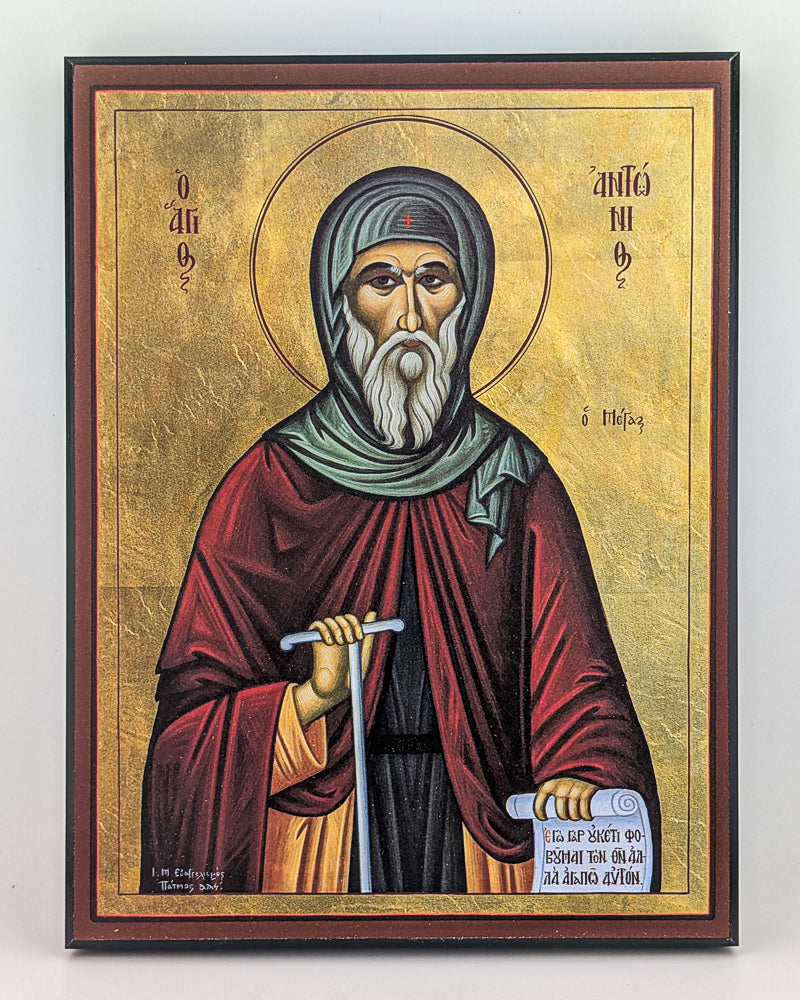 Icon of a religious figure with a gold background and wooden frame.