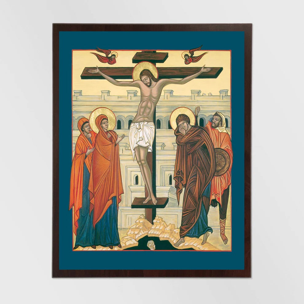 Framed artwork of the crucifixion with a blue border and dark frame.