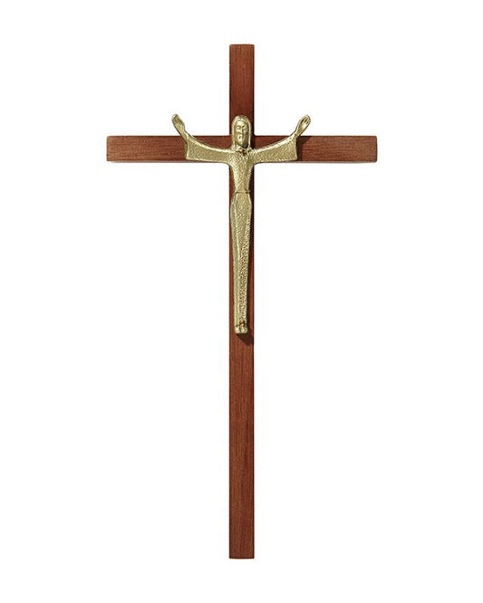 Wooden cross with a gold figure of Jesus on a white background