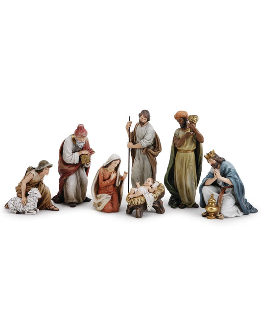 Set of nativity scene figurines on a white background