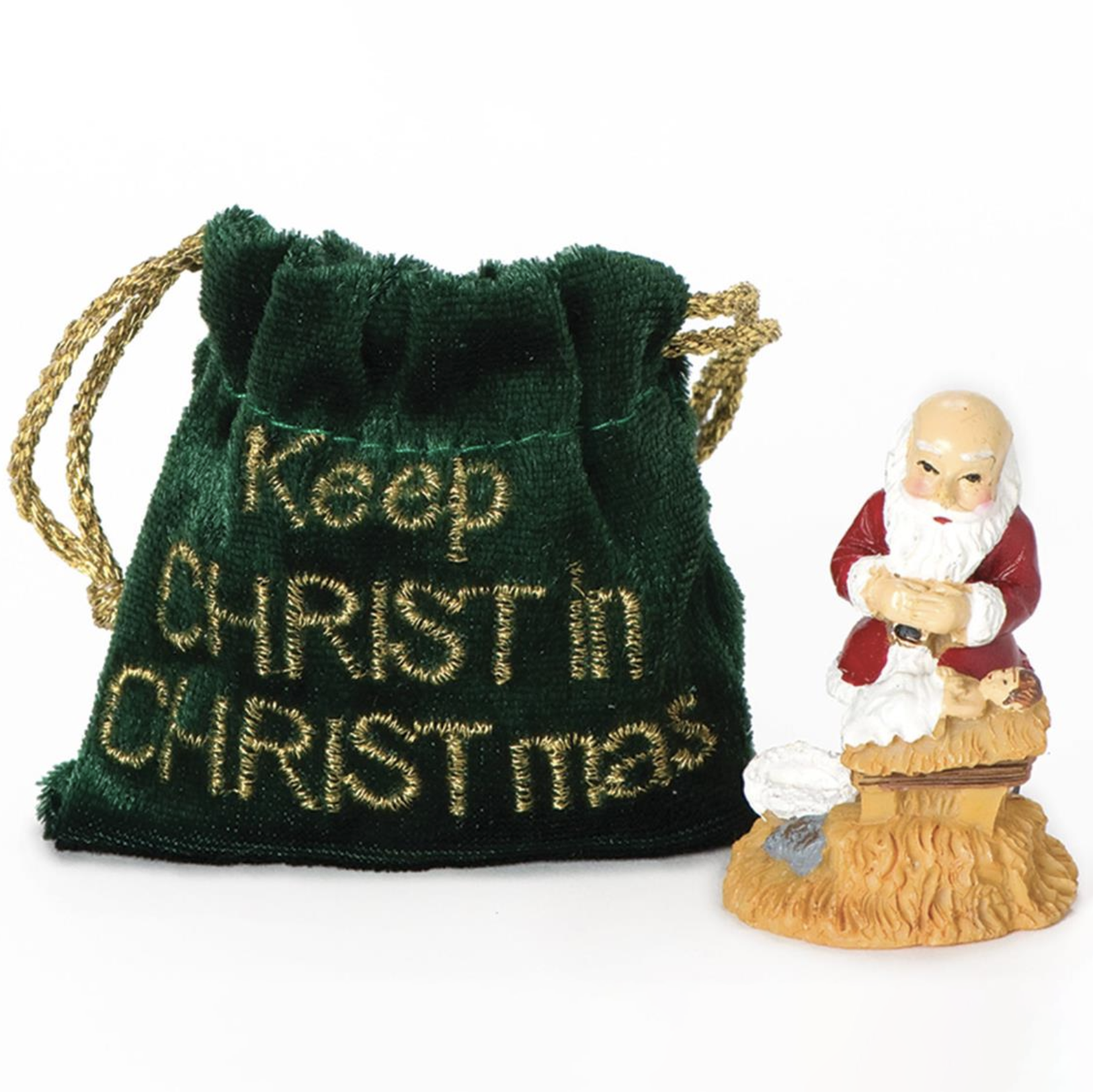 Green drawstring bag with 'Keep Christ in Christmas' text and a Santa Claus figurine on a white background