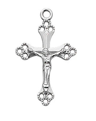 Silver crucifix pendant on a white background