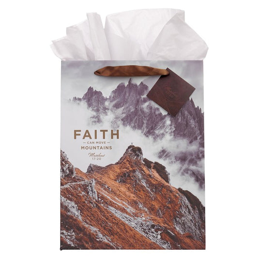 Gift bag with mountain design and 'Faith can move mountains' text