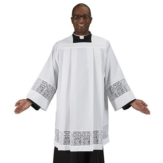 Man wearing a white liturgical vestment with black and white embroidery on a white background