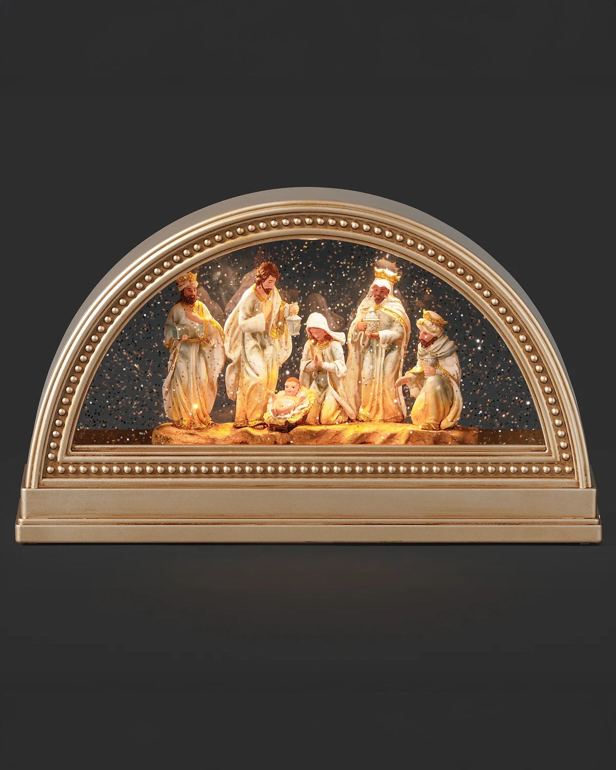 Decorative nativity scene with arch frame on a dark background