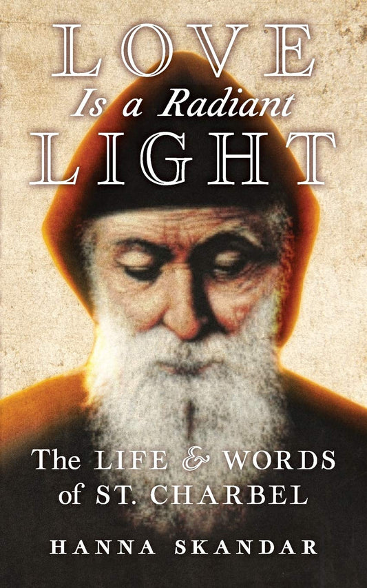Book cover of 'Love Is a Radiant Light: The Life & Words of St. Charbel' by Hanna Skandar with a portrait of a man.