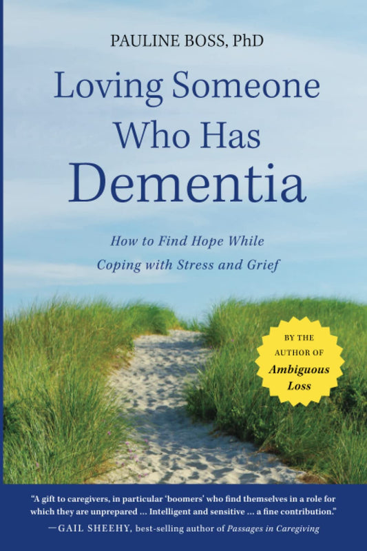 Book cover of 'Loving Someone Who Has Dementia' with a path leading to a beach.