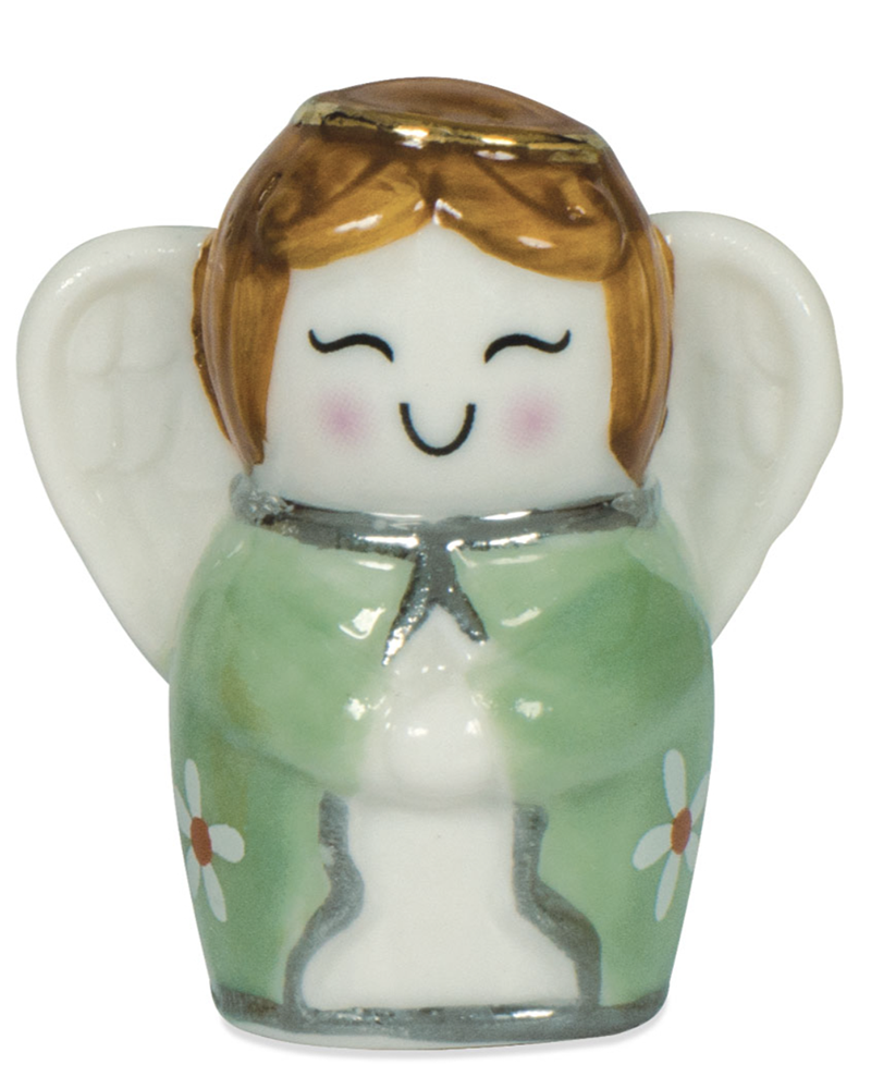 Small angel figurine with brown hair and green dress on a white background