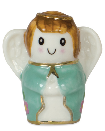 Small angel figurine with a green dress and gold accents on a white background