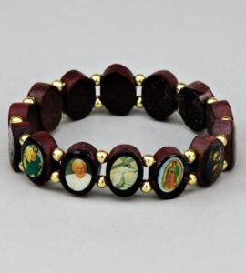 A stretch bracelet made of dark reddish-brown wooden beads with gold spacer rings and oval religious medallions on the front, shown on a neutral gray background.
