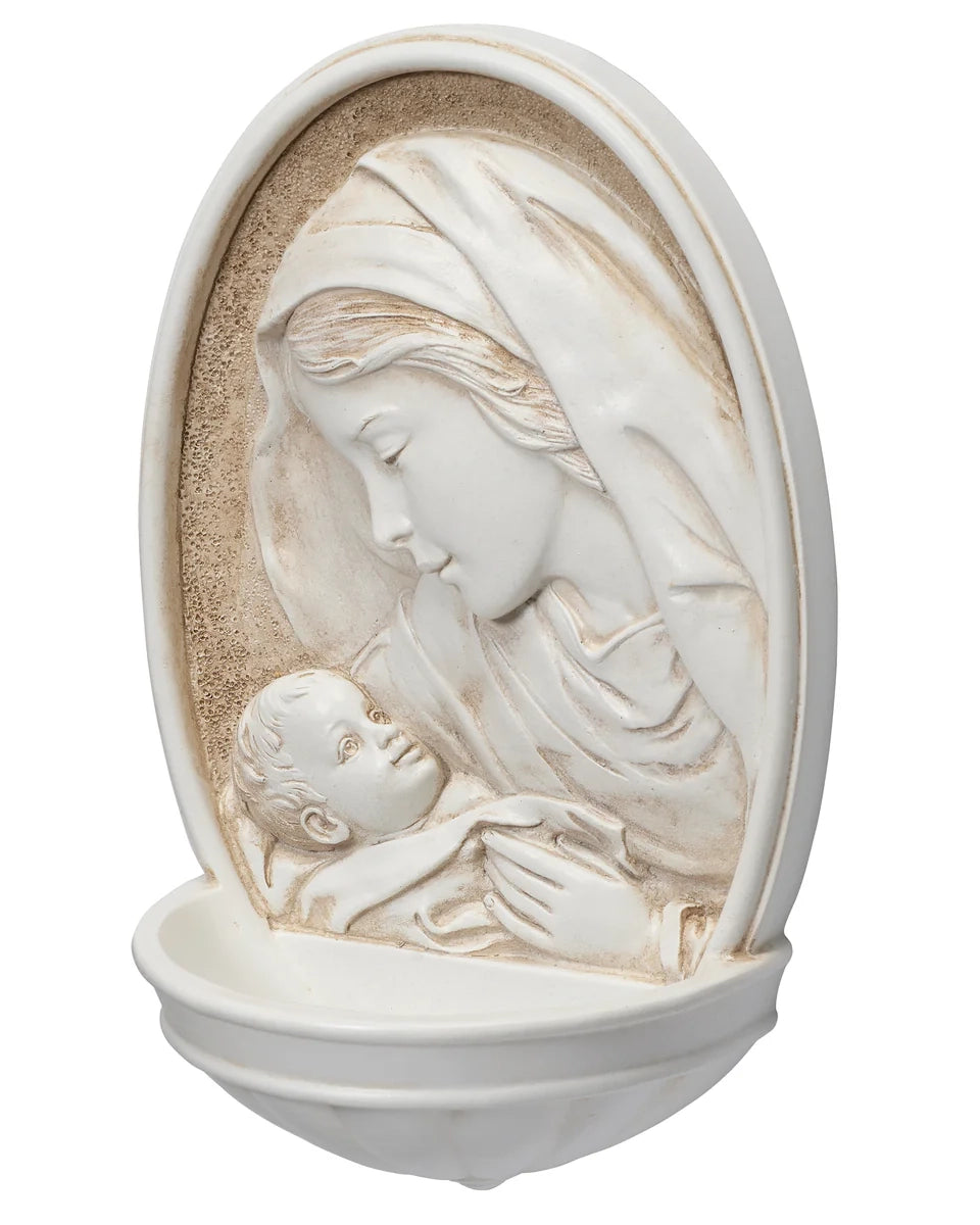 Decorative wall piece with relief of a woman and child, white and beige color scheme.