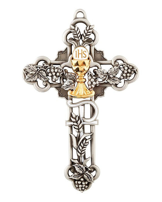 Decorative cross pendant with chalice detail on a white background
