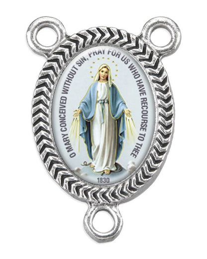 Silver religious pendant with a depiction of a religious figure on a white background