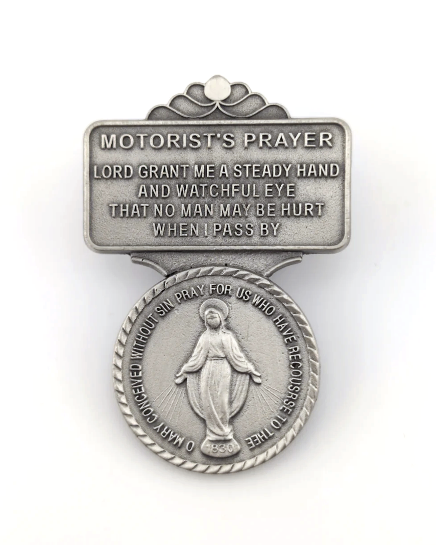 Motorist's prayer badge with religious design on a white background