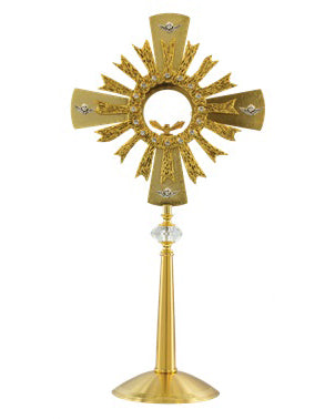Decorative gold cross with sunburst design on a white background