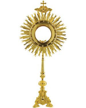 Gold monstrance on a white background