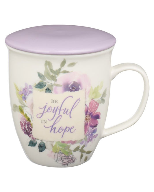 Mug with floral design and motivational quote on a white background