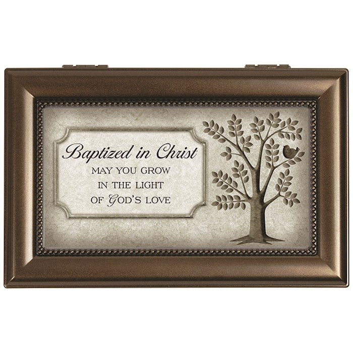 Decorative box with tree design and text on a white background