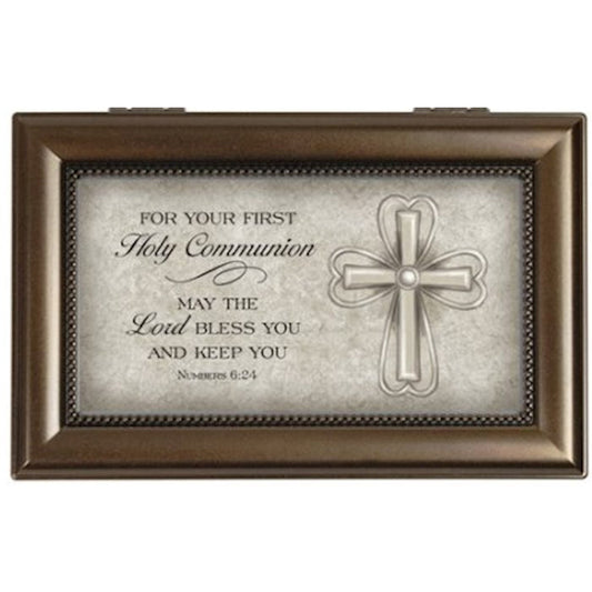 Decorative box with religious text and cross design on a white background
