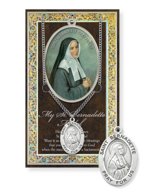 St. Bernadette pendant with prayer card on a white background