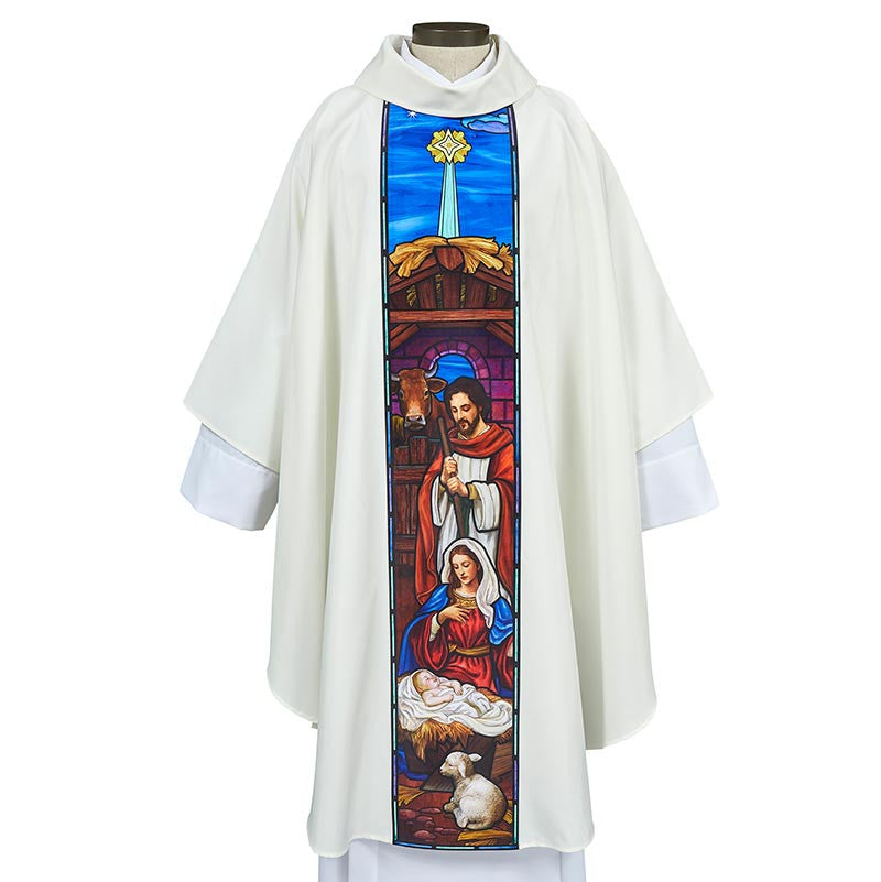 White liturgical vestment with a stained glass panel depicting a nativity scene on a white background