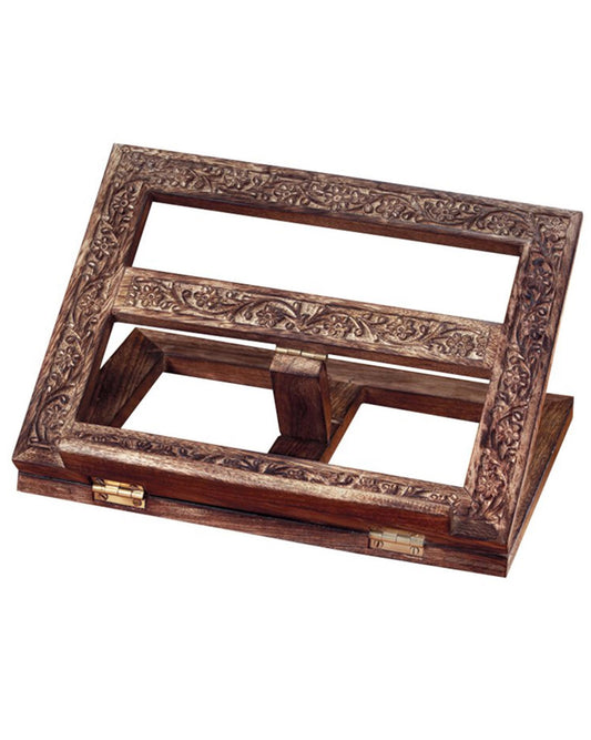 Wooden book stand with intricate carvings on a white background
