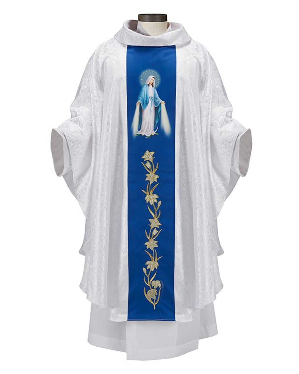 A white satin chasuble with a blue orphrey featuring a digitally-printed depiction of Our Lady of Grace with embroidered lilies and gold accents on a royal blue satin background, displayed on a mannequin.