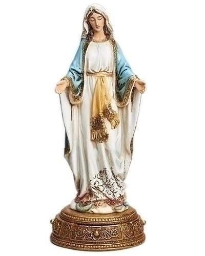 Statue of a religious figure with a white robe and blue headscarf on a gold pedestal.