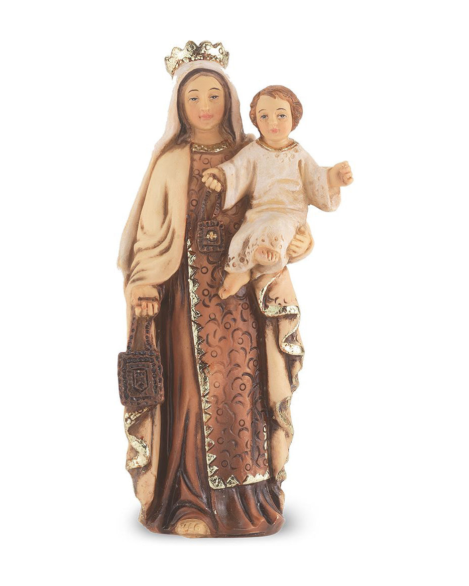 Statue of a woman holding a child with intricate details on a white background