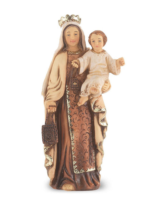 Statue of a woman holding a child with intricate details on a white background