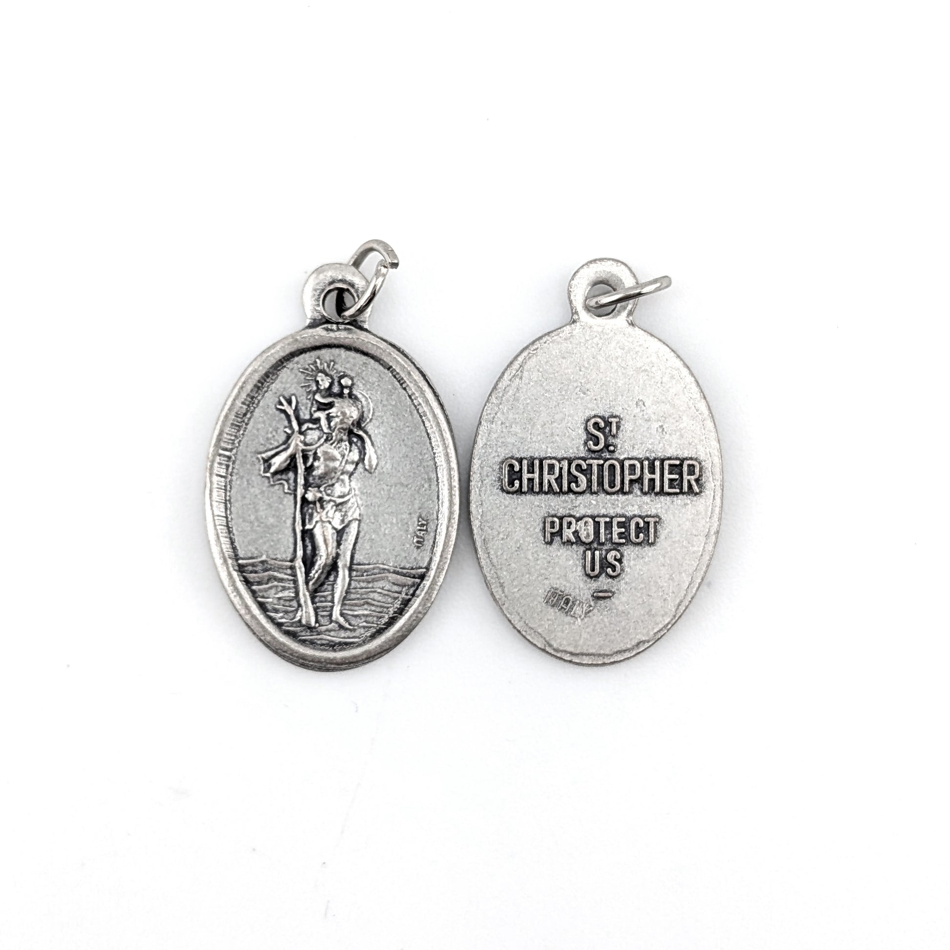 Silver St. Christopher medal on a white background