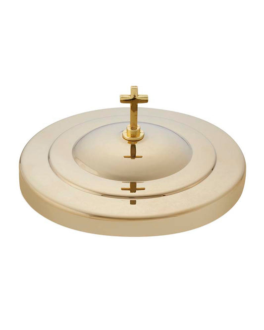 Gold circular object with cross-like designs on a white background