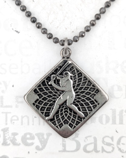 Silver pendant necklace with a detailed design on a white background