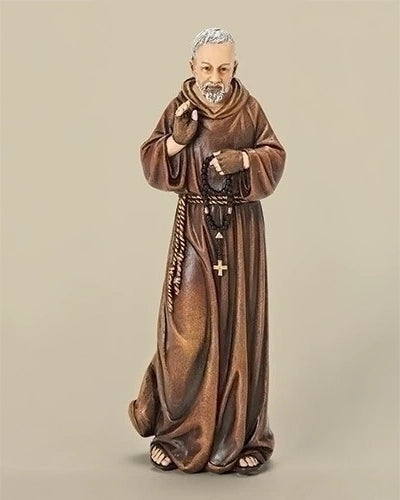 Statue of a religious figure in brown robes on a beige background