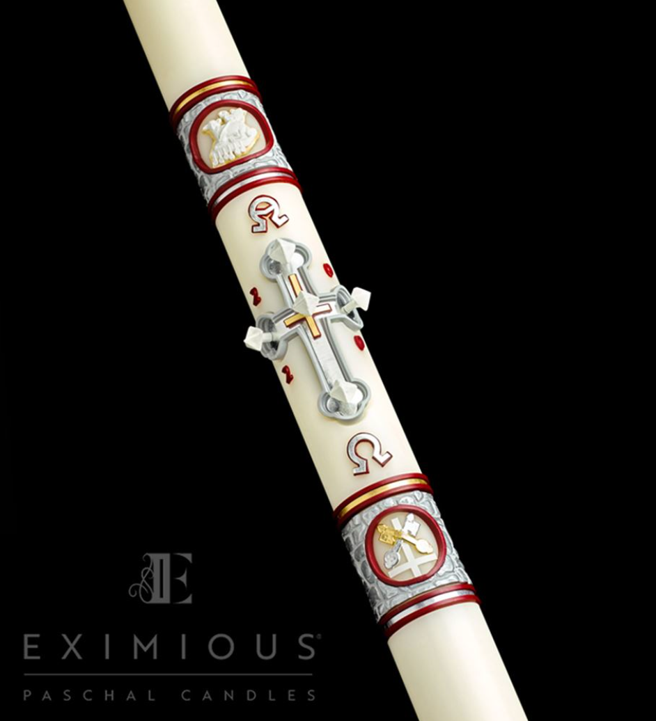 Decorative Paschal candle with religious symbols on a black background, featuring the brand 'Eximious'.