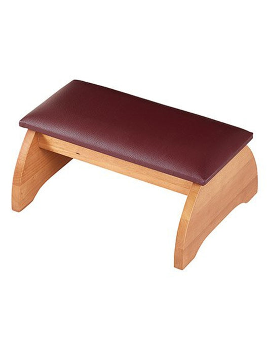 Wooden stool with a brown leather seat on a white background