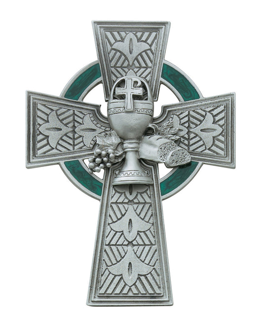 Decorative silver cross with green background on a white background
