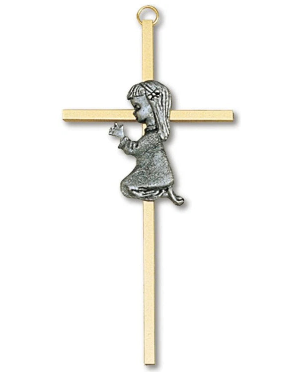 Gold cross pendant with a silver girl figure holding a heart on a white background