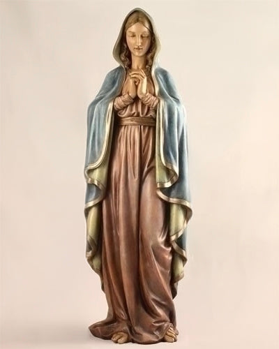 Statue of a woman in a long dress with a blue shawl on a beige background