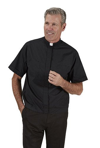 Man wearing a black clerical shirt with a white collar on a white background