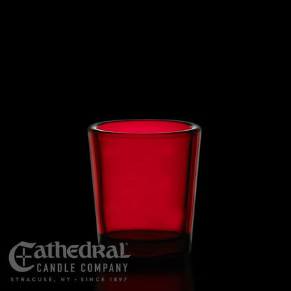 Red glass candle holder with Cathedral Candle Company logo on a black background