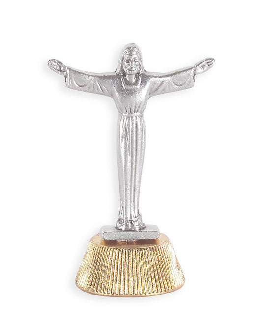 Silver statue of a figure with outstretched arms on a white background