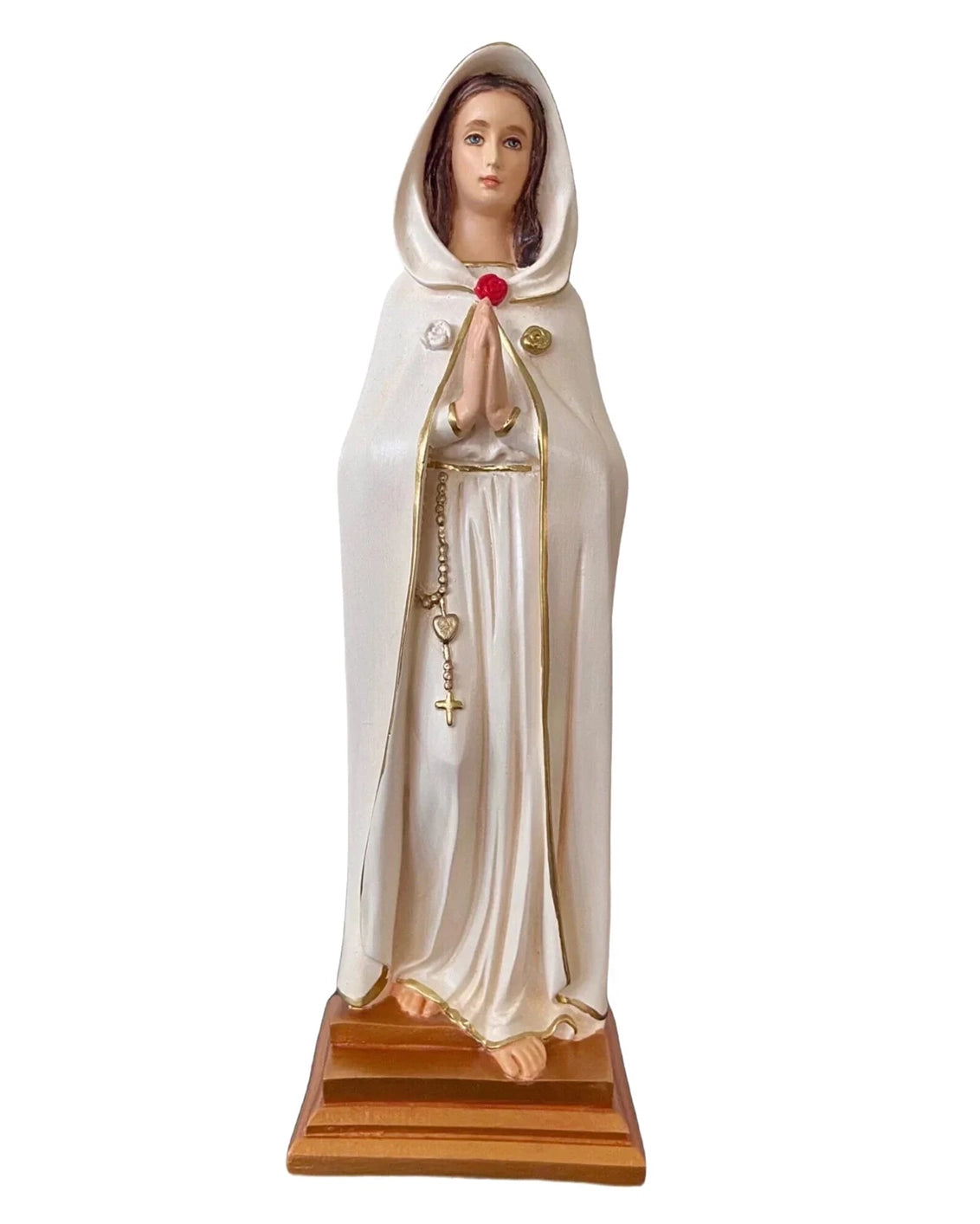 Statue of a religious figure in a white robe with a red flower on a white background