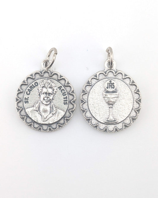 Two silver religious medallions on a white background