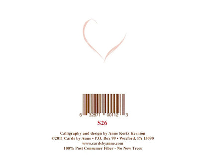 Back of a card with a heart design, barcode, and text on a white background