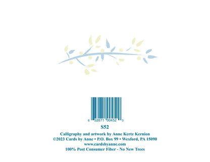 Back of a card with a barcode, leaf design, and contact information on a white background