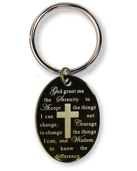 An oval black keychain with a gold cross and gold engraved Bible verse, attached to a silver metal split ring, on a white background.