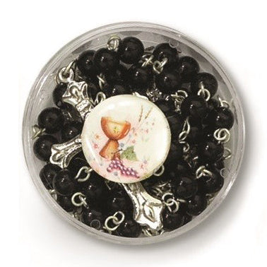 Decorative button with floral design on black beads in a clear container