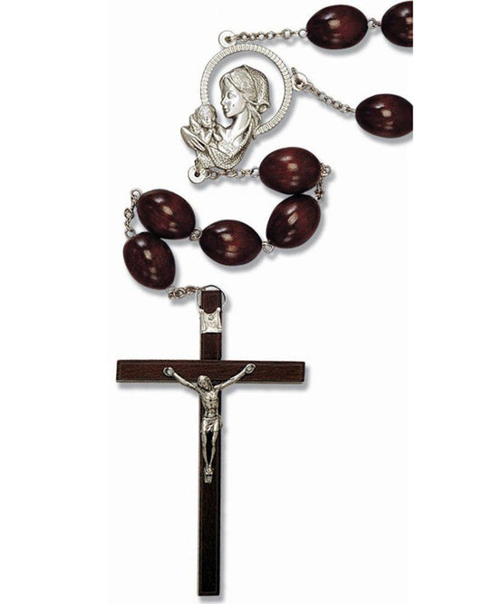 Wooden wall rosary with silver crucifix and medal on a white background