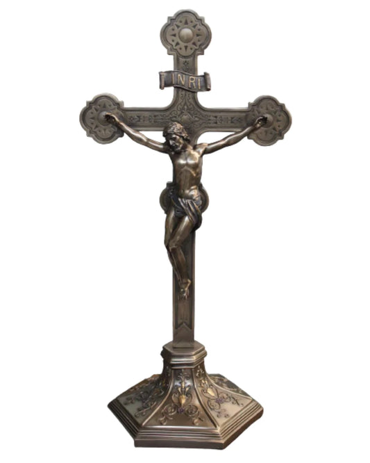 Bronze crucifix on a white background